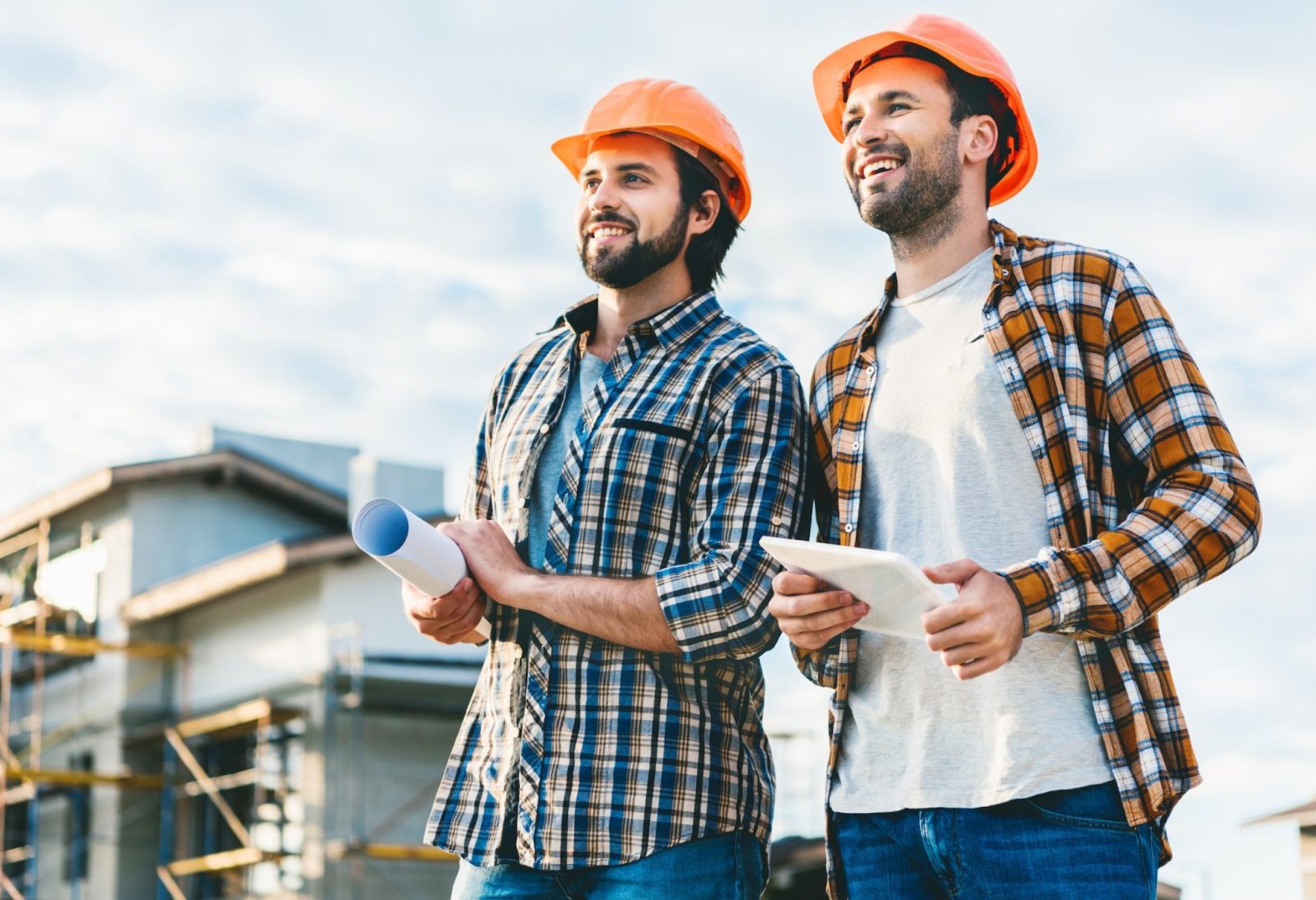architects-with-blueprint-and-tablet-looking-away-at-construction-site-1536x1025